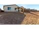 Rear view of house showcasing the landscaping and yard at 40532 W Wade Dr, Maricopa, AZ 85138