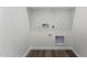 Laundry area with hookups and shelving at 40532 W Wade Dr, Maricopa, AZ 85138