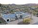 Stunning aerial view of a luxury home with desert landscaping and mountain views at 6737 E Rockaway Hills Dr, Cave Creek, AZ 85331