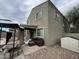 Home's backyard featuring a covered patio, seating area, and a view of the home's exterior at 23671 W Wayland Dr, Buckeye, AZ 85326