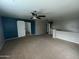 This large bonus room features a ceiling fan, and a barn door at 23671 W Wayland Dr, Buckeye, AZ 85326