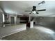 Open floorplan view of a kitchen with granite countertops next to a living space at 23671 W Wayland Dr, Buckeye, AZ 85326