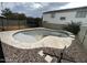 Outdoor view of an empty swimming pool, showing the design and surrounding patio at 23671 W Wayland Dr, Buckeye, AZ 85326