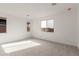 Spacious bedroom with neutral carpeting and ample natural light at 40105 W Elm Dr, Maricopa, AZ 85138