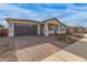 New construction home with a two-car garage and landscaped front yard at 40105 W Elm Dr, Maricopa, AZ 85138