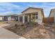 New home with a two-car garage and front yard landscaping at 40105 W Elm Dr, Maricopa, AZ 85138