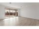 Living room with sliding glass doors leading to the backyard at 40105 W Elm Dr, Maricopa, AZ 85138