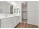 Modern bathroom with double vanity and a large closet at 40115 W Elm Dr, Maricopa, AZ 85138