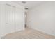 Well-lit bedroom with double door closet and carpet flooring at 40115 W Elm Dr, Maricopa, AZ 85138