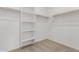 Large walk-in closet with shelving and hanging rods at 40115 W Elm Dr, Maricopa, AZ 85138