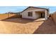 Spacious backyard with covered patio and block wall at 40090 W Elm Dr, Maricopa, AZ 85138