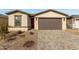 New construction home with a two-car garage and landscaped front yard at 40090 W Elm Dr, Maricopa, AZ 85138