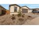 New construction home with a two-car garage and landscaped front yard at 40090 W Elm Dr, Maricopa, AZ 85138