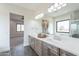 Bright bathroom featuring a double vanity with a large mirror reflecting the desert view at 9626 E Bunny Ear Ln, Gold Canyon, AZ 85118