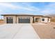 Beautiful single-story home with a large driveway and a two car garage at 9626 E Bunny Ear Ln, Gold Canyon, AZ 85118