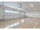 Spacious, epoxy-floored three-car garage with bright lighting and dual doors at 9626 E Bunny Ear Ln, Gold Canyon, AZ 85118