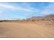 Expansive desert landscape with native vegetation and majestic mountain backdrop at 9626 E Bunny Ear Ln, Gold Canyon, AZ 85118