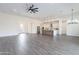 Open concept living room and kitchen with dark wood tile floors at 9626 E Bunny Ear Ln, Gold Canyon, AZ 85118