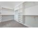 Walk-in closet featuring carpet flooring and white shelving at 9626 E Bunny Ear Ln, Gold Canyon, AZ 85118