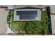 Aerial view showcasing backyard with solar panels and artificial turf at 160 S Azteca Dr, Eloy, AZ 85131