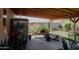Relaxing backyard patio with covered seating area and beautiful landscaping at 160 S Azteca Dr, Eloy, AZ 85131