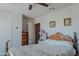Bedroom with double bed, ceiling fan, and dresser at 160 S Azteca Dr, Eloy, AZ 85131