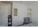 Bedroom with a chair, mirror, and closet at 160 S Azteca Dr, Eloy, AZ 85131