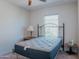 Spacious bedroom with a bed, nightstand, and ample natural light at 160 S Azteca Dr, Eloy, AZ 85131