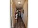 Bright entryway with wood floors and access to living room at 160 S Azteca Dr, Eloy, AZ 85131