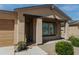 House entrance with brown door, window shutters, and walkway at 160 S Azteca Dr, Eloy, AZ 85131