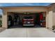Two-car garage with storage cabinets and room for a vehicle at 160 S Azteca Dr, Eloy, AZ 85131