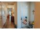 Hallway with wood floors, leading to bedrooms and bathroom at 160 S Azteca Dr, Eloy, AZ 85131