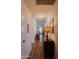 Long hallway with hardwood floors and artwork at 160 S Azteca Dr, Eloy, AZ 85131