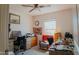 Bright home office features built-in desk and comfortable chair at 160 S Azteca Dr, Eloy, AZ 85131