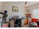 Home office with desk, chair, and ample natural light at 160 S Azteca Dr, Eloy, AZ 85131