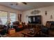Bright and inviting living room with comfortable seating and a large TV at 160 S Azteca Dr, Eloy, AZ 85131