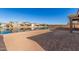 Spacious backyard with a lake view and nice landscaping at 40500 W Wade Dr, Maricopa, AZ 85138