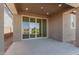 Patio with sliding doors leading to a pond view at 40500 W Wade Dr, Maricopa, AZ 85138