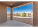 Covered patio overlooking a serene lake view at 40500 W Wade Dr, Maricopa, AZ 85138