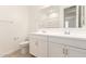 Clean bathroom with double vanity and updated fixtures at 40500 W Wade Dr, Maricopa, AZ 85138
