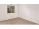 Bright bedroom featuring a large window and neutral decor at 40500 W Wade Dr, Maricopa, AZ 85138