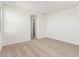 Spacious bedroom with neutral carpeting and an adjacent bathroom at 40500 W Wade Dr, Maricopa, AZ 85138
