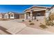 New construction home with stone accents and two-car garage at 40500 W Wade Dr, Maricopa, AZ 85138