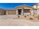 Attractive home exterior, featuring a garage and driveway at 40500 W Wade Dr, Maricopa, AZ 85138