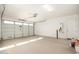 Spacious garage with overhead door and extra space at 40500 W Wade Dr, Maricopa, AZ 85138