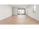 Living room with sliding doors leading to patio and pool at 40500 W Wade Dr, Maricopa, AZ 85138