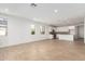 Bright living room with tile floors and access to backyard at 40500 W Wade Dr, Maricopa, AZ 85138
