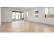 Spacious living area with sliding glass doors and tile floors at 40500 W Wade Dr, Maricopa, AZ 85138