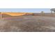 Large, empty backyard with block wall at 21641 N Daniel Dr, Maricopa, AZ 85138