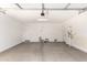 Spacious garage with two doors and concrete floor at 21641 N Daniel Dr, Maricopa, AZ 85138